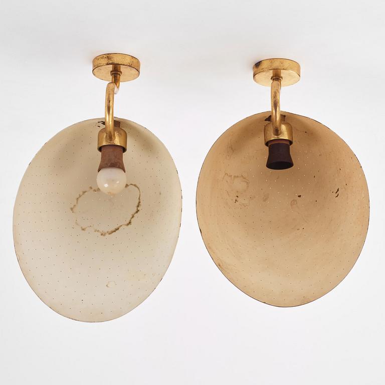 Carl-Axel Acking, a pair of brass wall lamps, model "5019", Bröderna Malmströms metallvarufabrik, Malmö 1940s-50s.