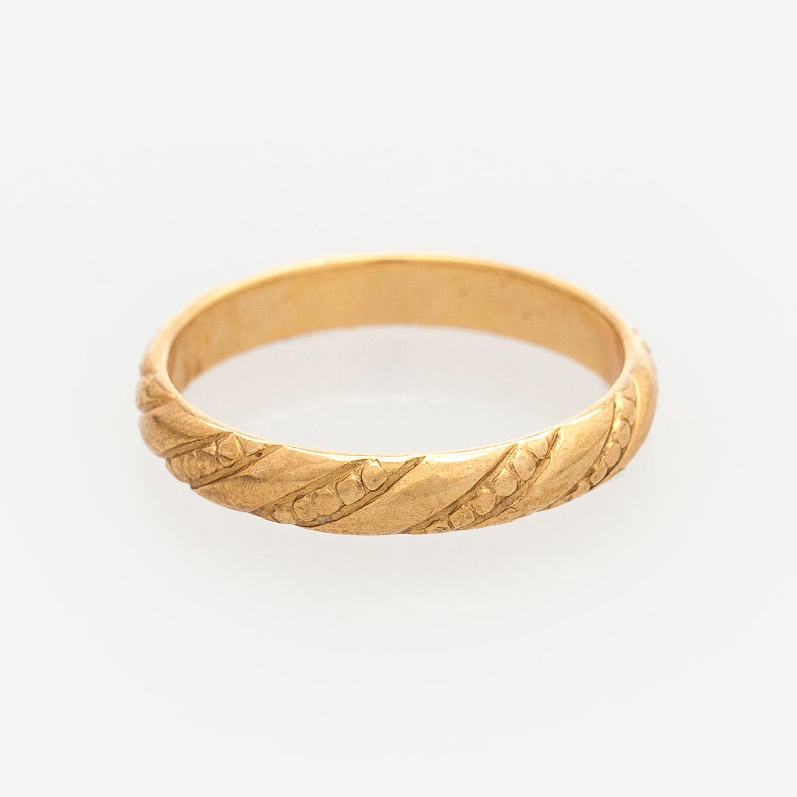 Kalevala Koru, ring "Halikon Lampolan kierresormus", 18K guld, Helsingfors 1998.