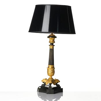A French Louis Philippe ormolu and patinated bronze lamp, first part 19th century.