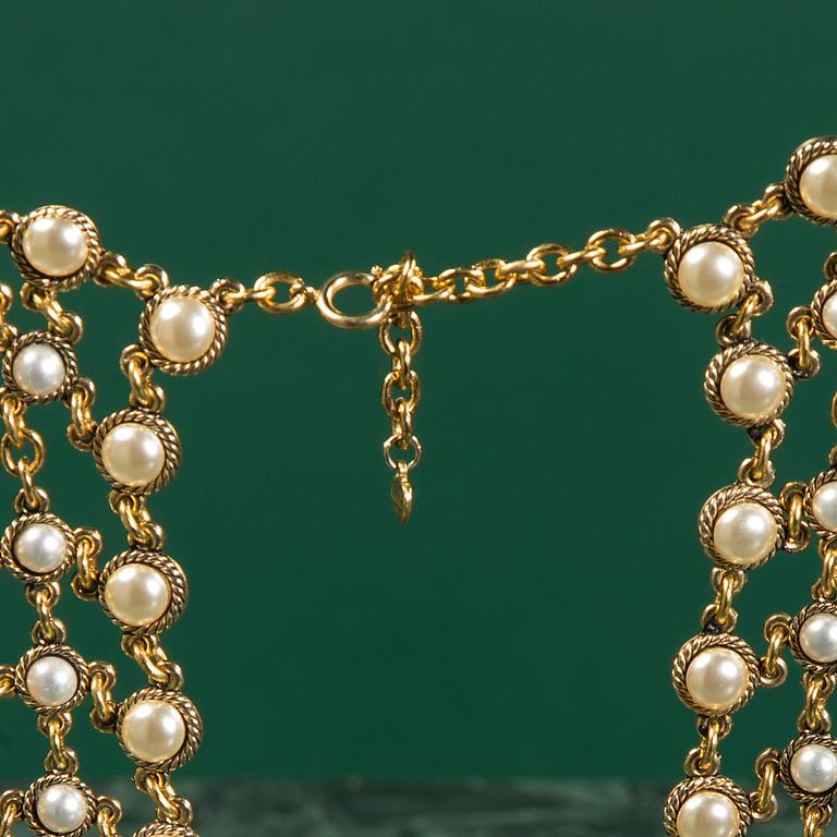 A necklace by MOSCHINO.