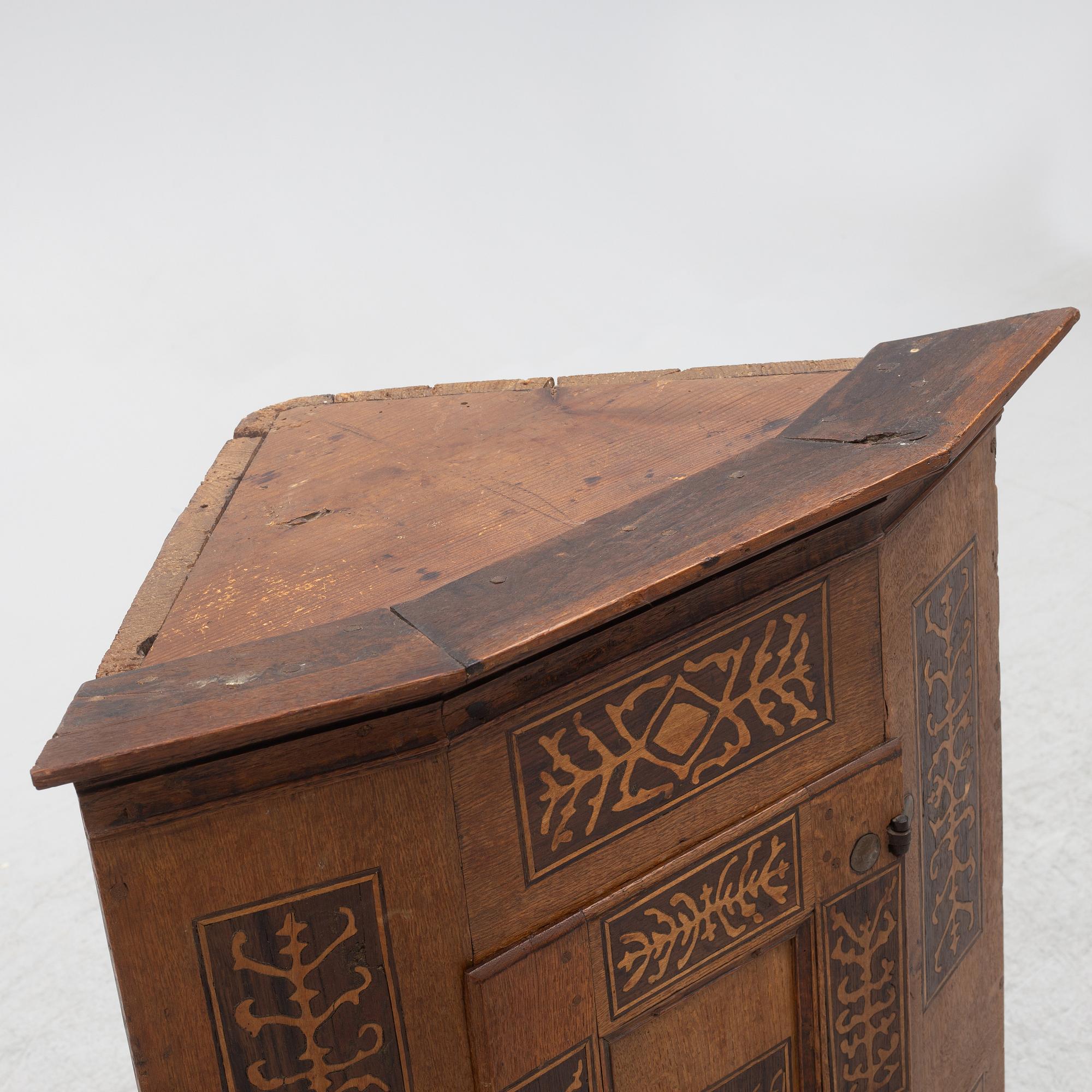 Corner cabinet, dated 1769.