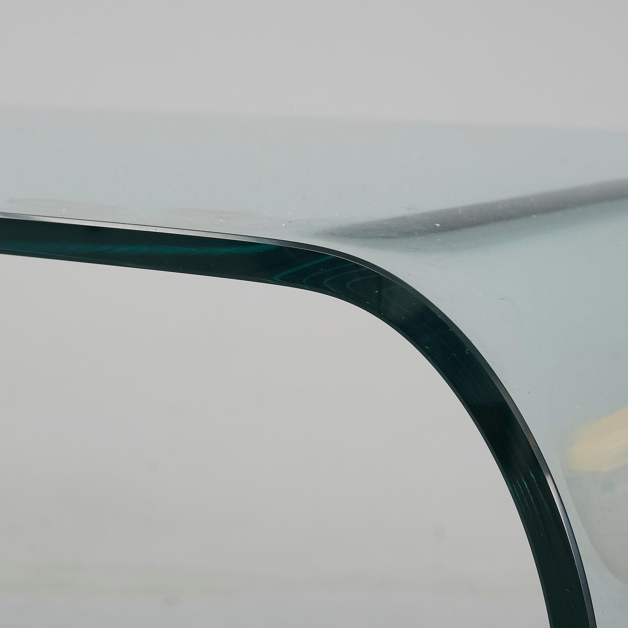 A mid 20th Century glass coffee table.