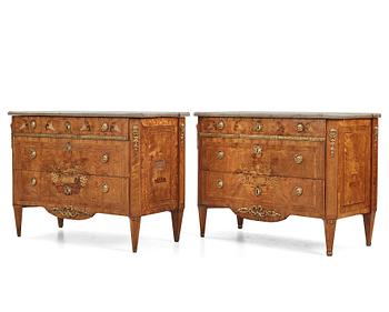 12. A matched pair of Gustavian ormolu-mounted limestone topped and marquetry commodes by C. Lindborg, late 18th century.