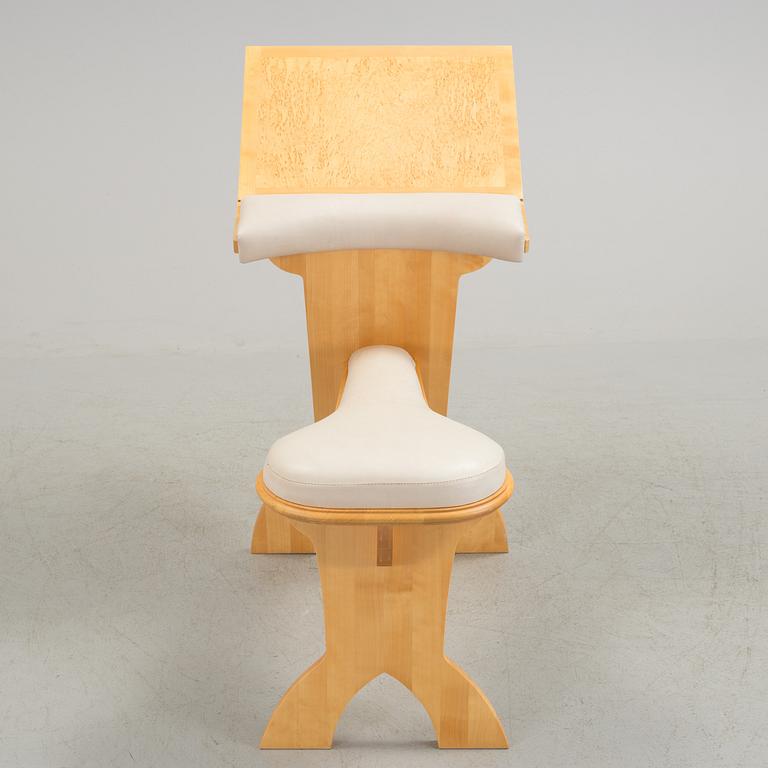 a "plugghästen" chair by Peter Lind.