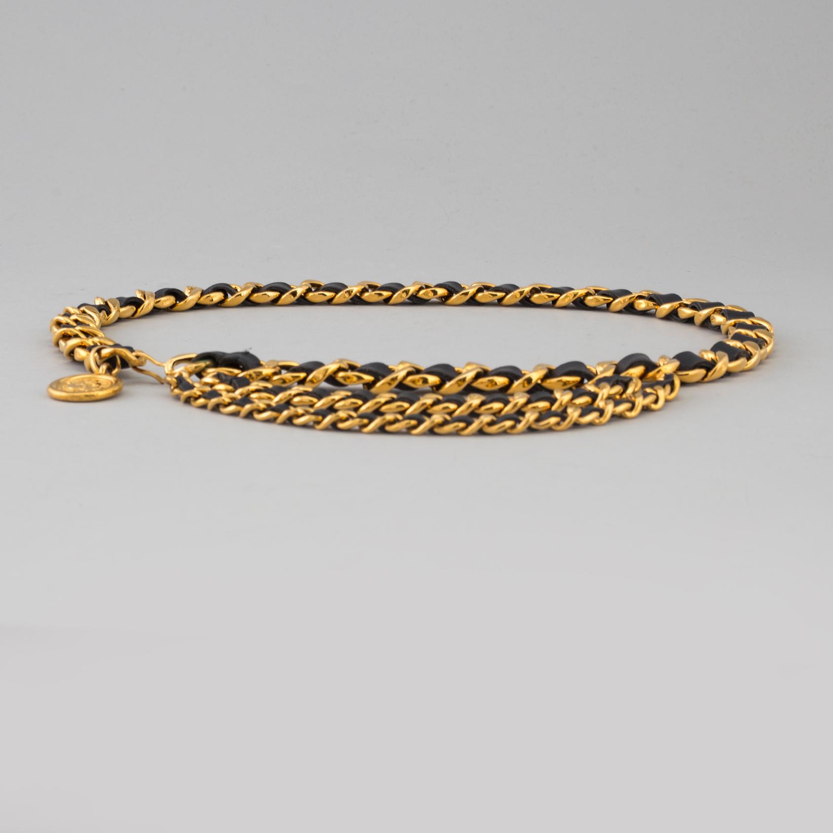 CHANEL, a metal and leather belt.