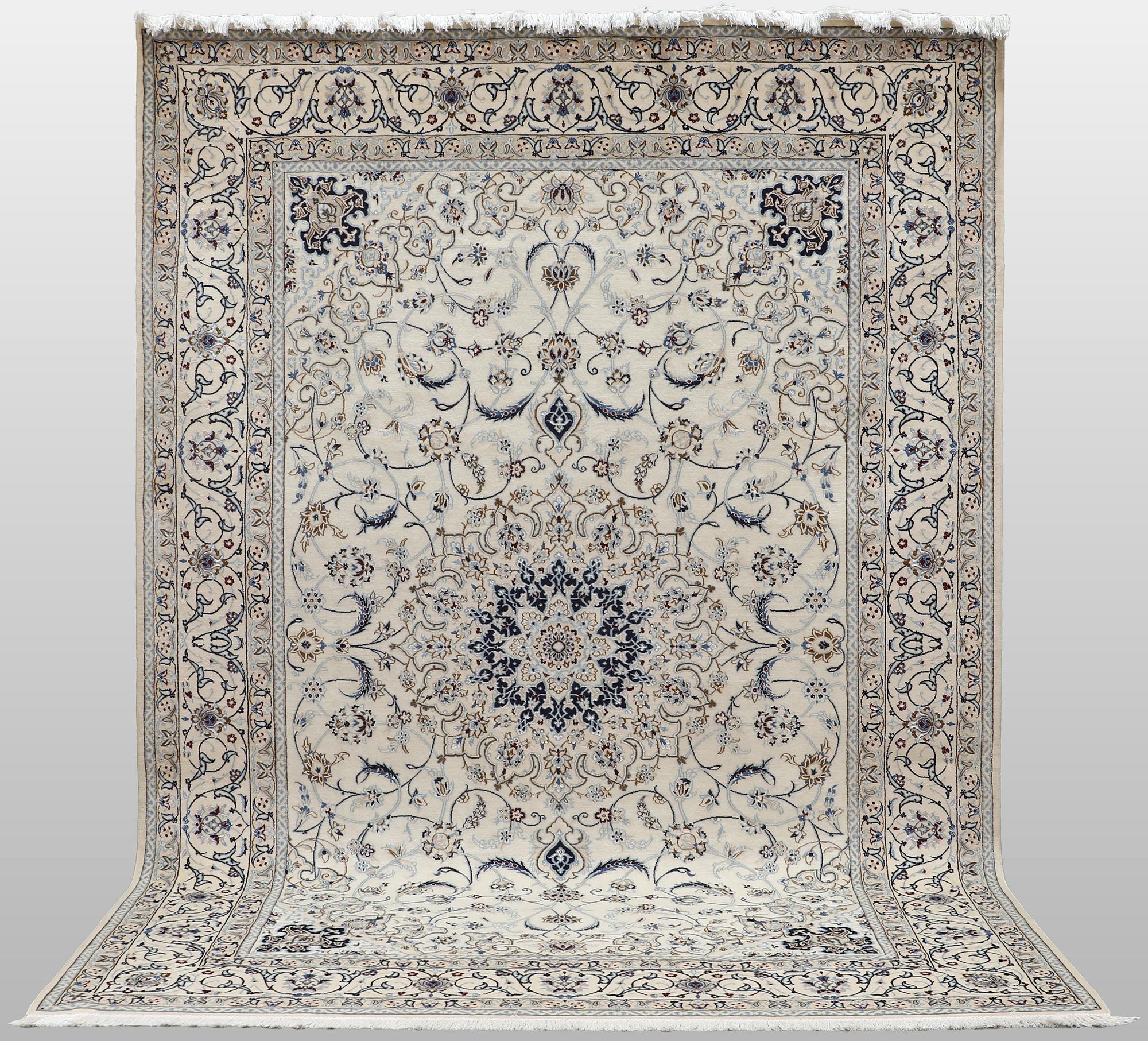 A Nain carpet, part silk, so-called 9 LAA, approx. 355 x 248 cm.