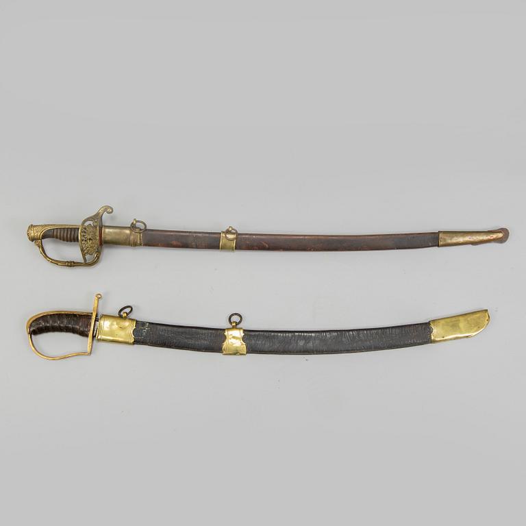An end of the 18th Century Swedish sabre and a 19th century French century sabre, both with scabbards.