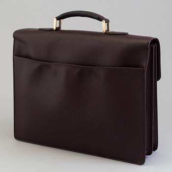 A 'Moskova' taiga leather briefcase from Louis Vuitton.