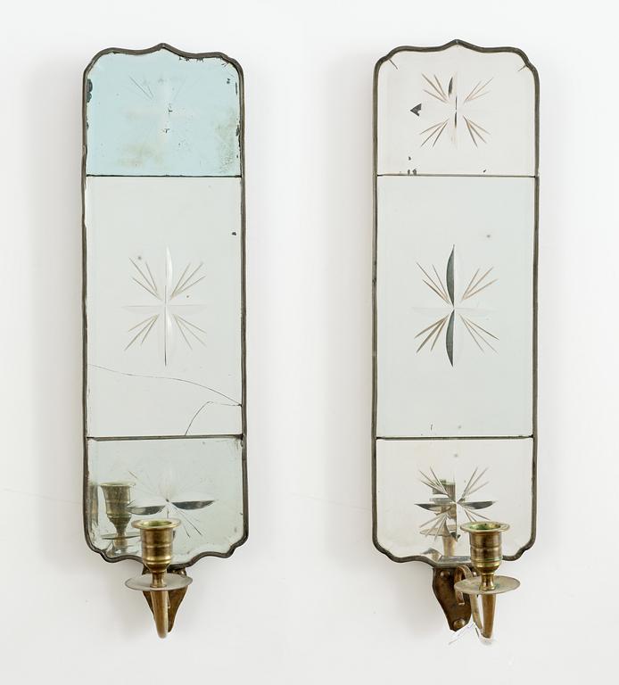 A pair of Swedish one light girandole mirrors.