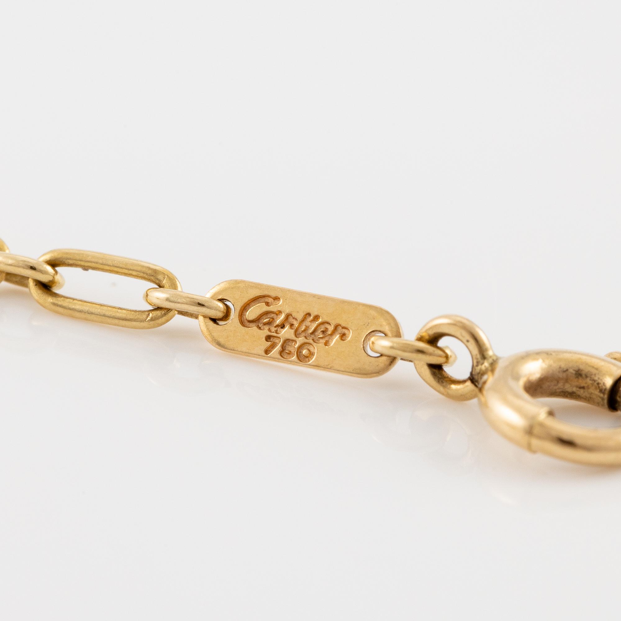 A Cartier necklace 18K multi-coloured gold "Trinity" cross.