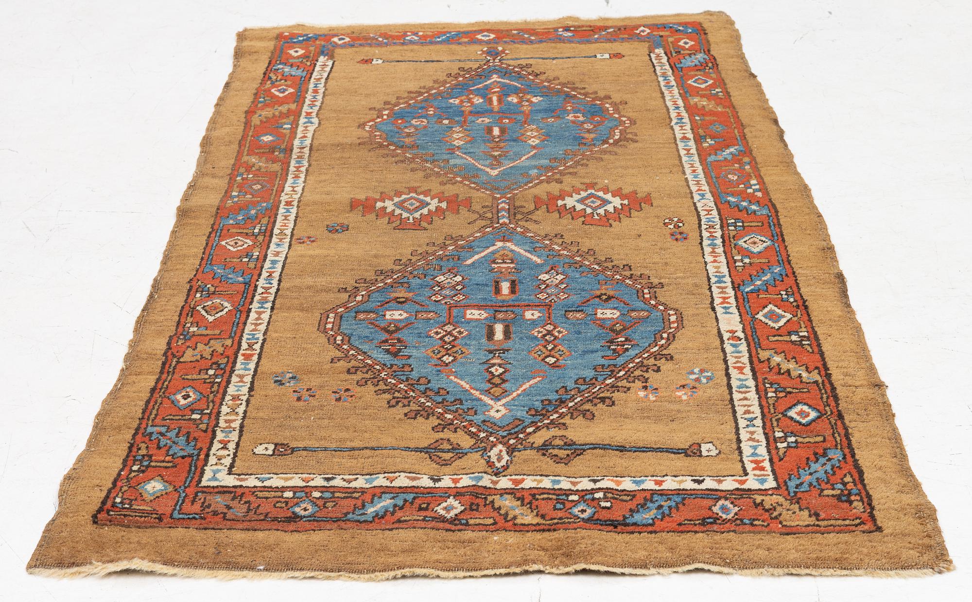 An antique Sarab rug, northwestern Iran, c. 213 x 107 cm.
