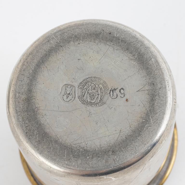 Svenskt Tenn, a pewter tray, bowl, jar and four coasters.