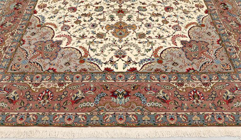 A part silk Tabriz carpet, so-called 50 Raj, approx. 356 x 250 cm.