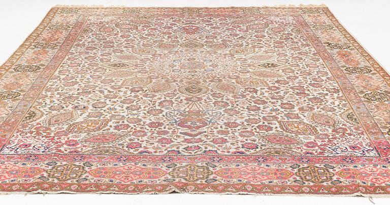A Tabriz carpet, c. 390 x 305 cm.