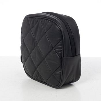 Chanel, tennis racket and 4 balls with case.