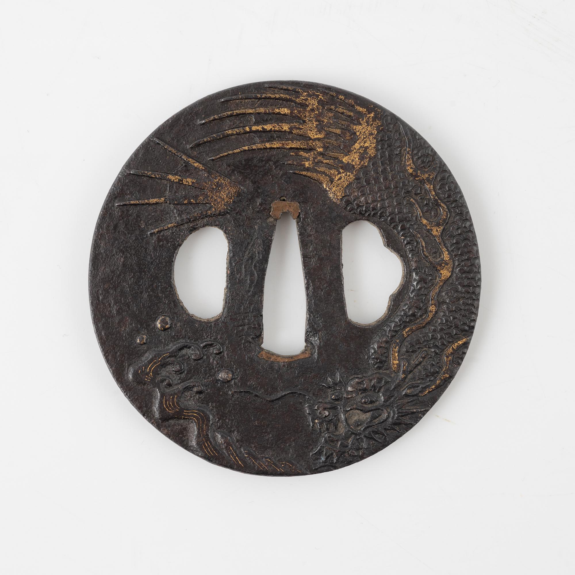 A round iron tsuba decorated with a dragon, Japan, Edo-period,