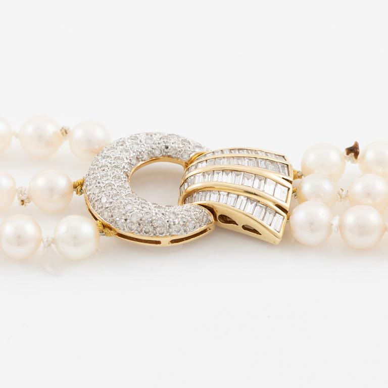 Pearl necklace, three strands of cultured pearls, clasp in 18K gold set with baguette and brilliant-cut diamonds.