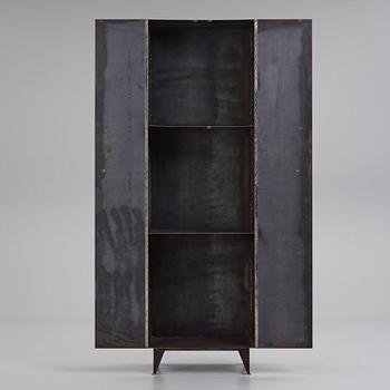 A contemporary patinated metal cabinet.