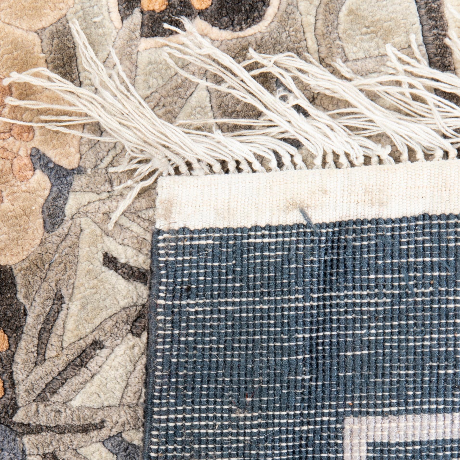 A Chinese old silk carpet ca 240x153 cm.