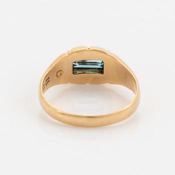 18K gold and greenblue stone ring.