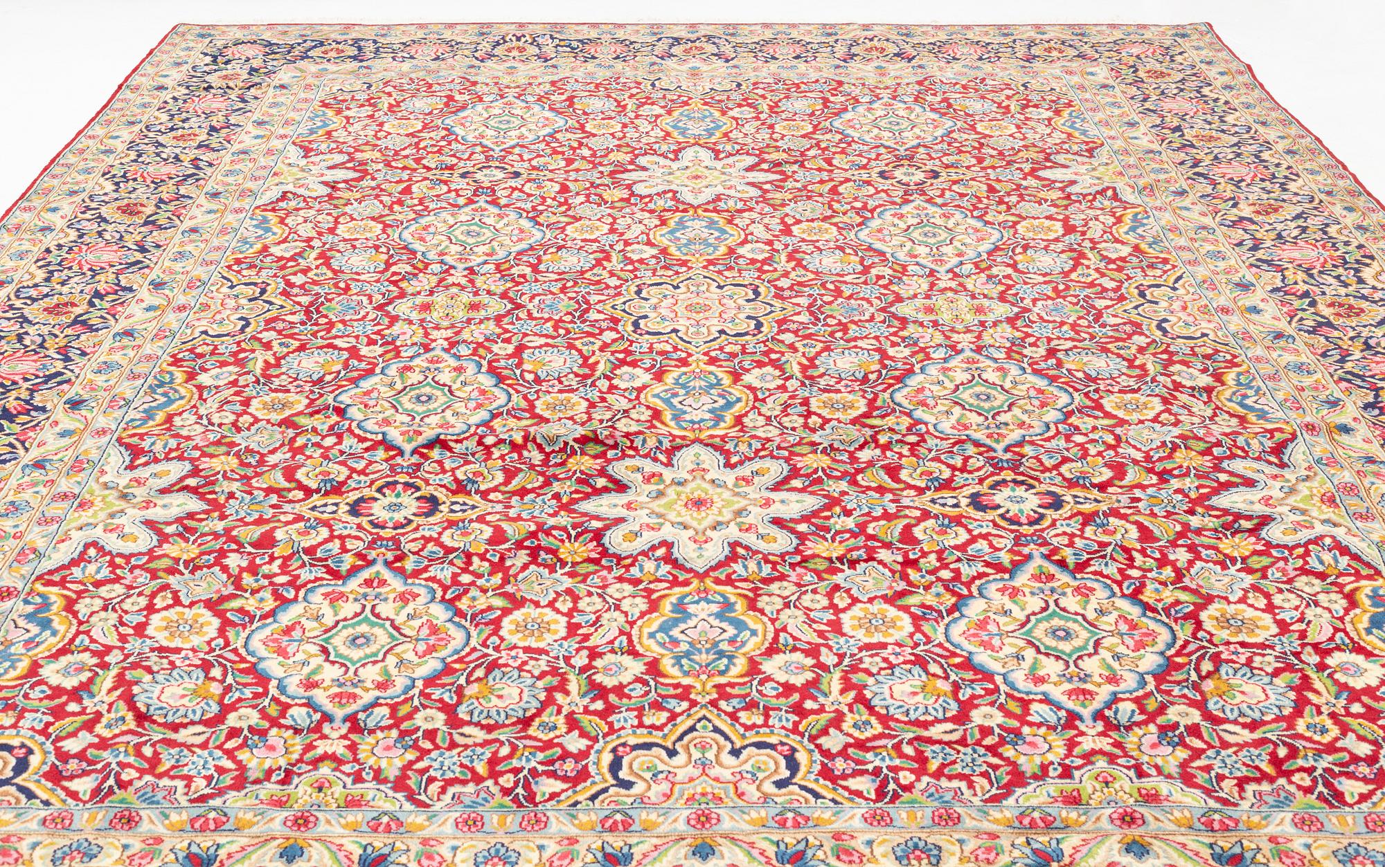 A Kerman carpet, 438 x 298 cm.
