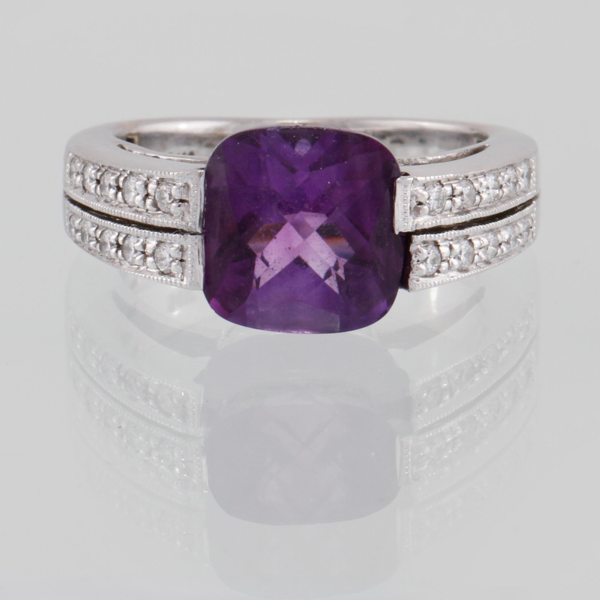 RING, 14k vitguld med checkerslipad ametist och 20 briljantslipade diamanter. Vikt 5 g.