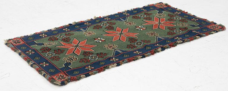 A Scania cross-stitch embroidered cushion, Sweden, around 1900, c. 99 x 47 cm.
