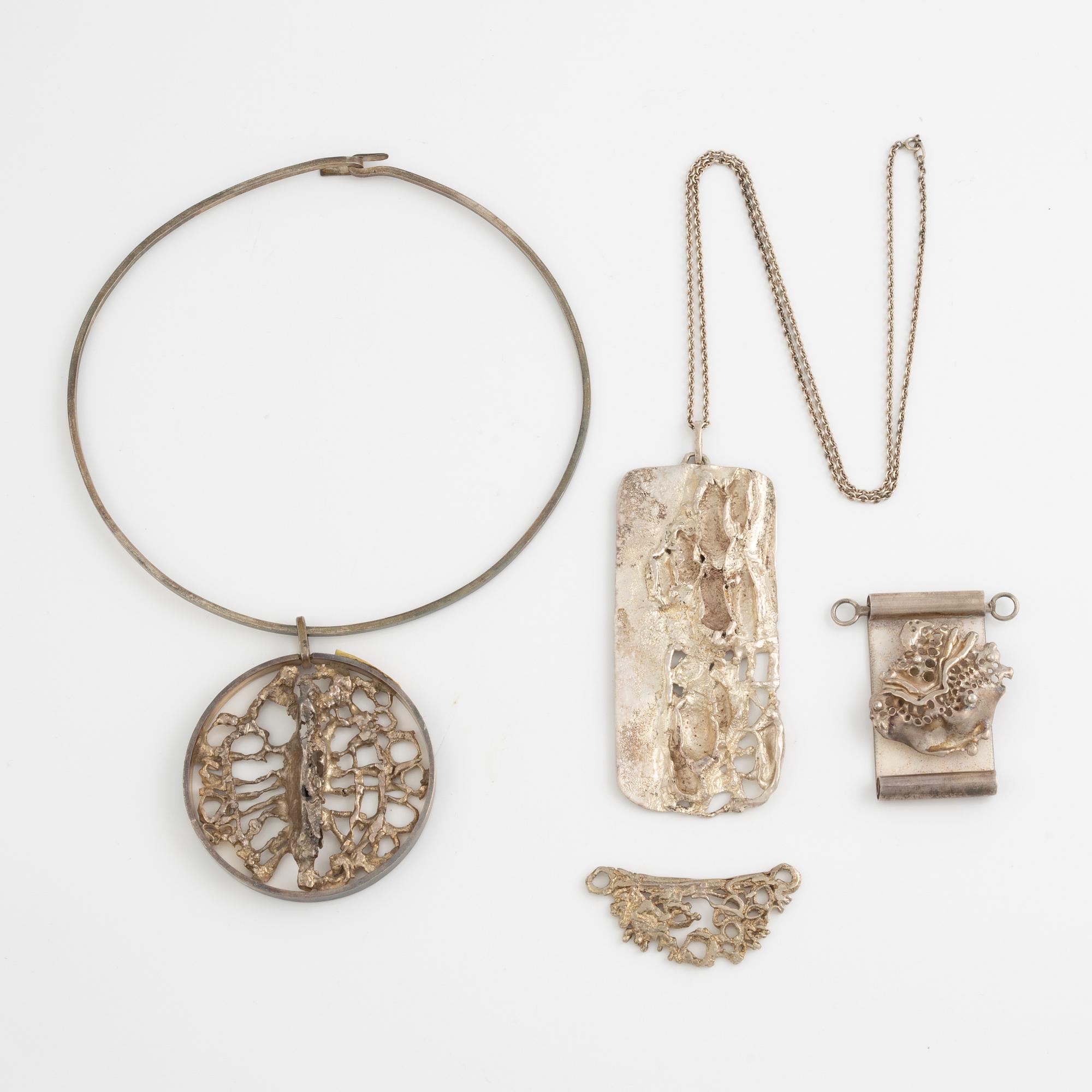 Lars Arby, four pendants with a chain and a neck ring, silver, Gothenburg 1965, 1969, 1976 and 1982.