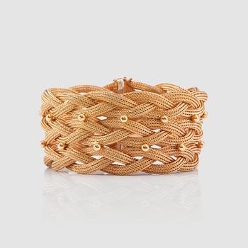 1209. A braided gold bracelet. Probably made in Italy.