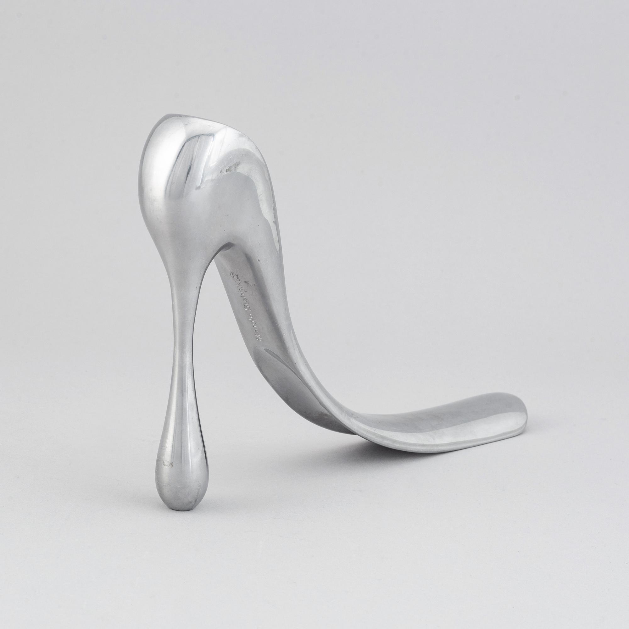 A metal shoe horn by Manolo Blahnik, 2000s.