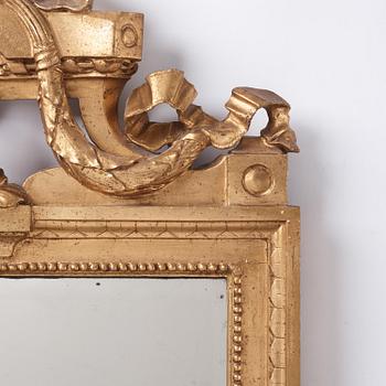 A Gustavian giltwood mirror by C. G. Fyrwald (master in Stockholm 1776-1825).