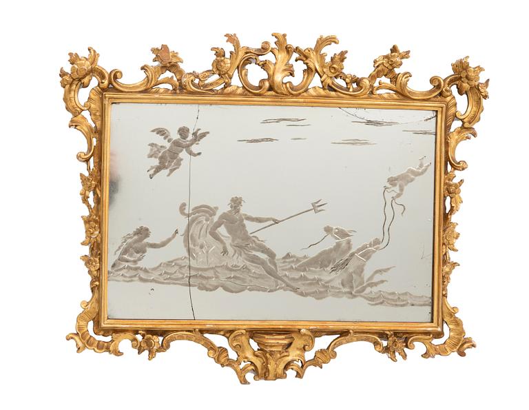 A gilded Louis XV style mirror around 1900.