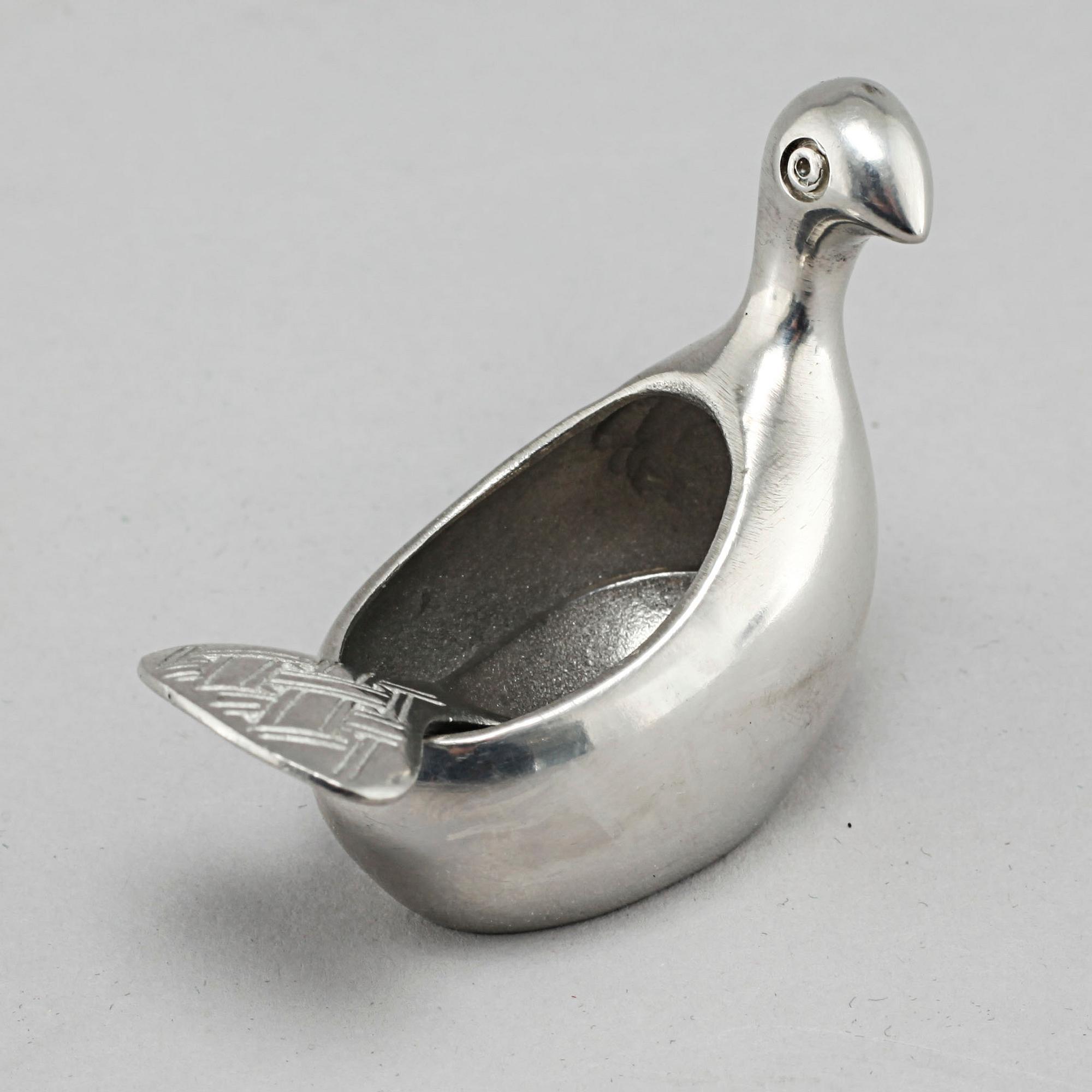 A "Kirun" salt bowl with spoon in pewter, made by Lars Pirak, second half of the 20th century.