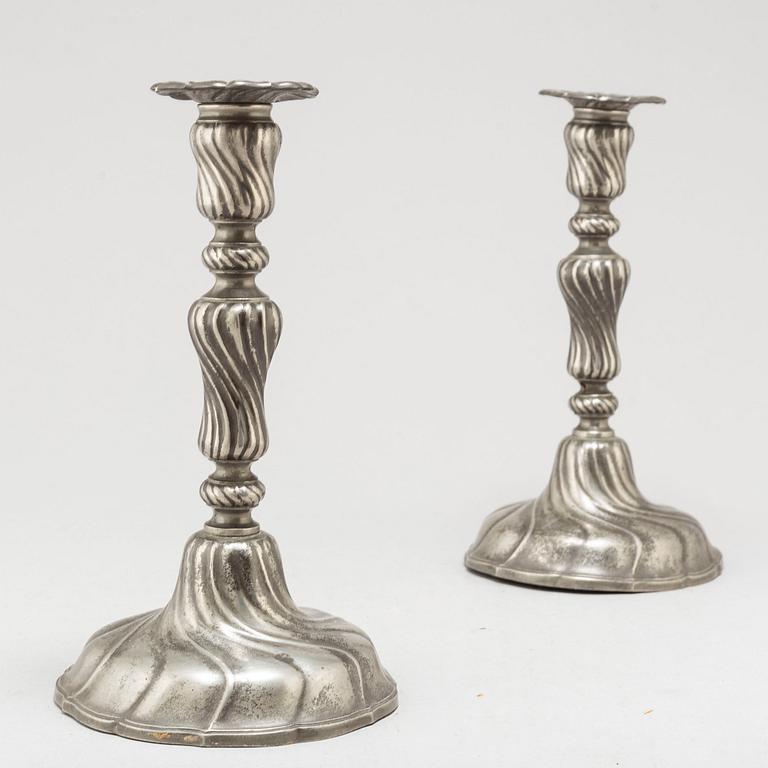 A PAIR OF ROCOCO PEWTER CANDLESTICKS, 18th century.