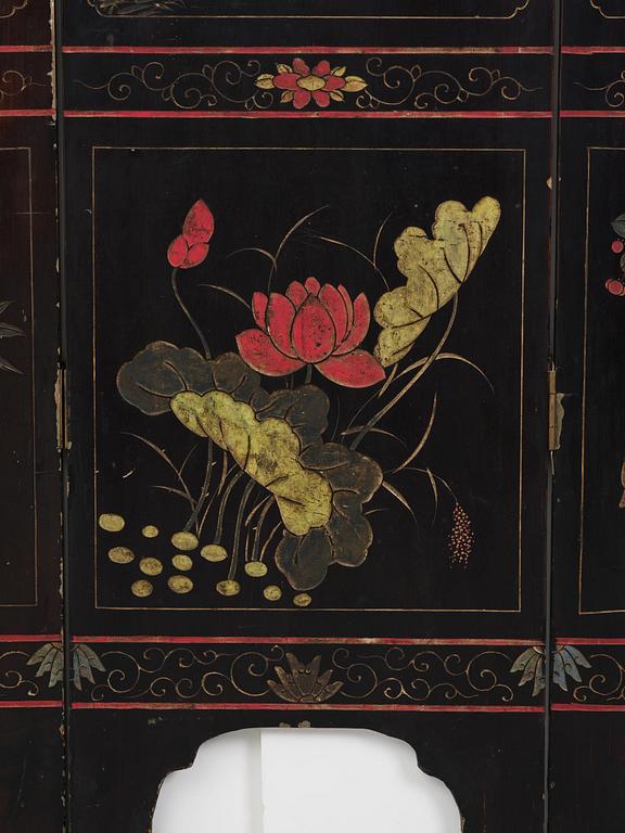 A Chinese four panel lacquer folding screen, first part of the 20th century.