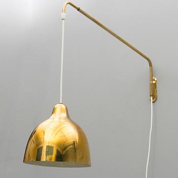 A mid 20th century wall light for Stockmann Orno, Finland.