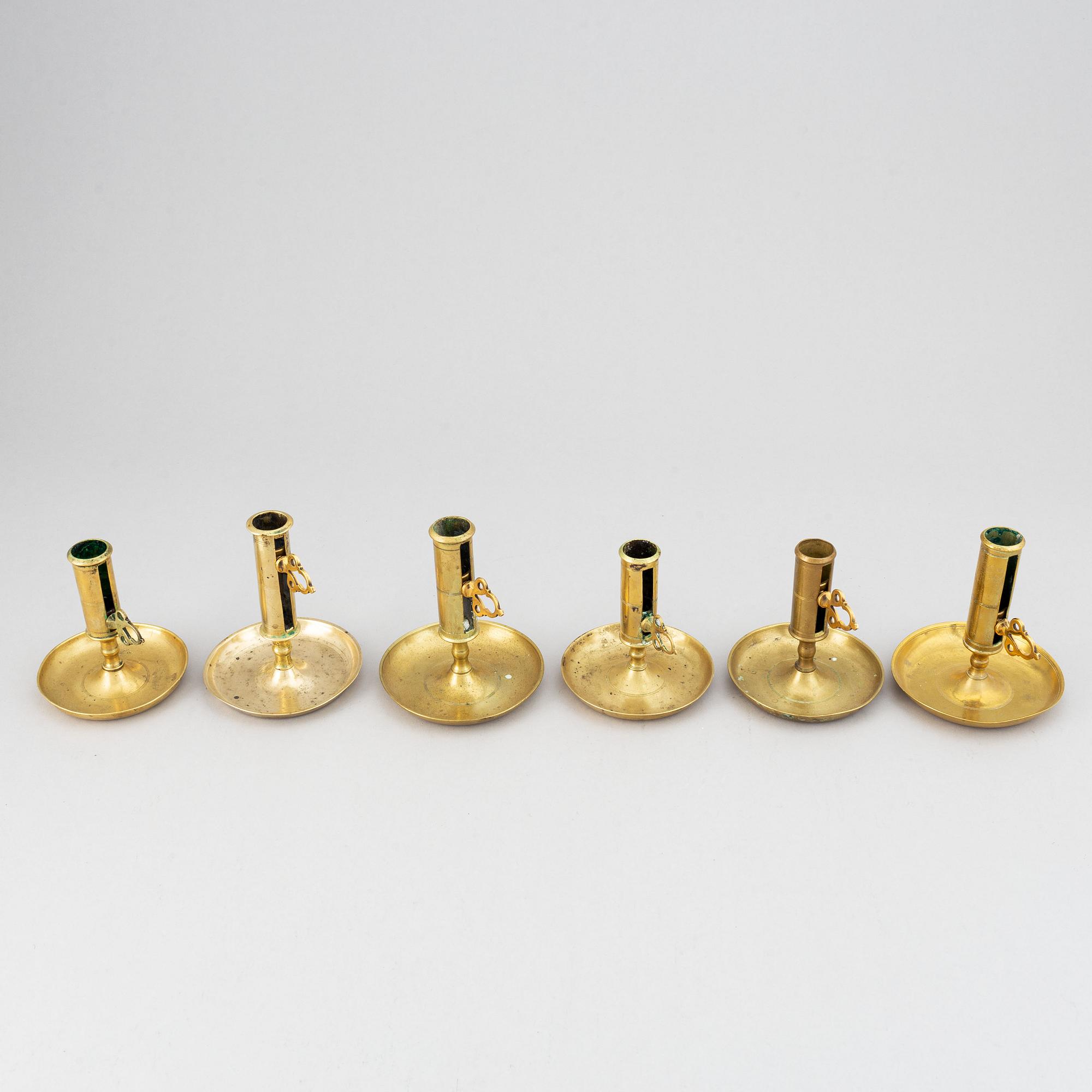A set of six 19th-century brass candlesticks.