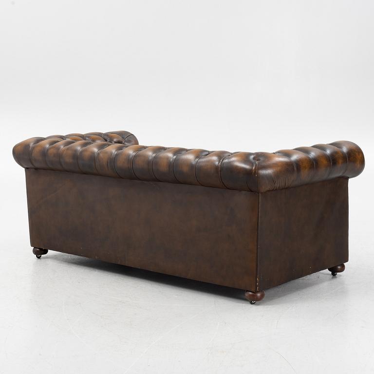 A leather upholstered Chesterfield sofa, England, second part of the 20th Century.