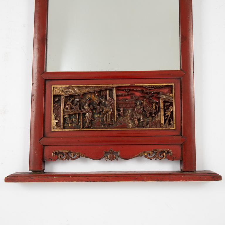 A lacquered mirror, Qing dynasty, 19th century.