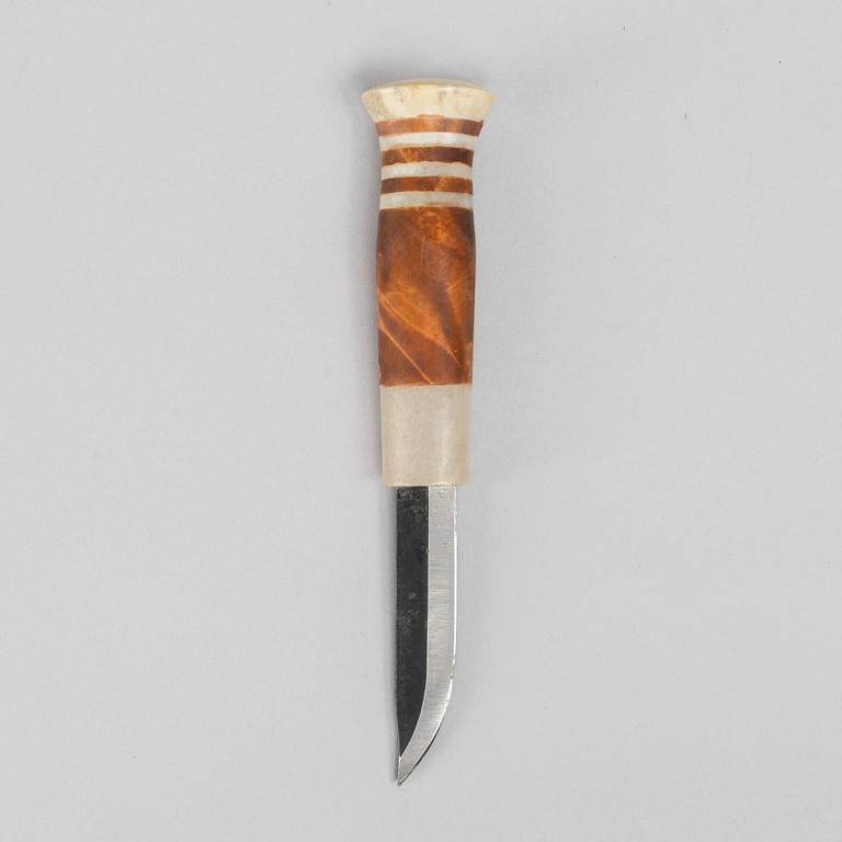 Lars Levi Sunna, a reindeer horn knife, signed.