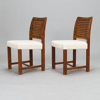 Carl Gustaf Hiort af Ornäs, a mid-20th Century dining table and eight chairs for  för HMN Huonekalu Mikko Nupponen.