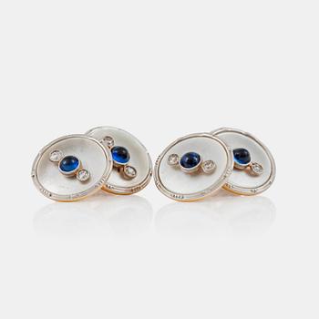 1181. A pair of mother of pearl, diamond and cabochon-cut sapphire cufflinks. Circa 1920.