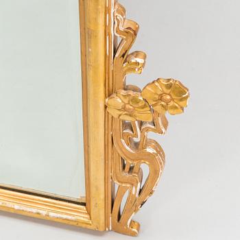 An Art Nouveau mirror with console table from early 20th century.