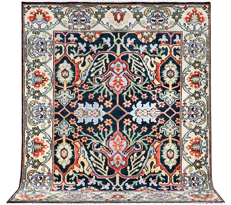 An oriental carpet with Mamluk design, c. 308 x 250 cm.