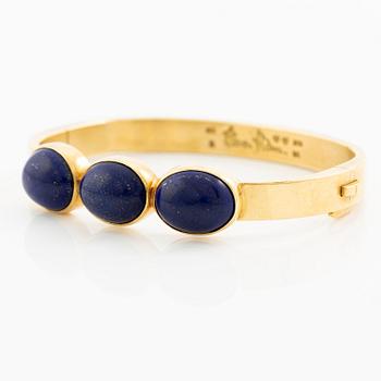 Wiwen Nilsson, a bracelet, 18K gold with lapis lazuli, Lund 1965.