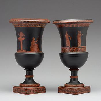 A matched pair of red figure glass vases, late empire, second half of 19th Century.