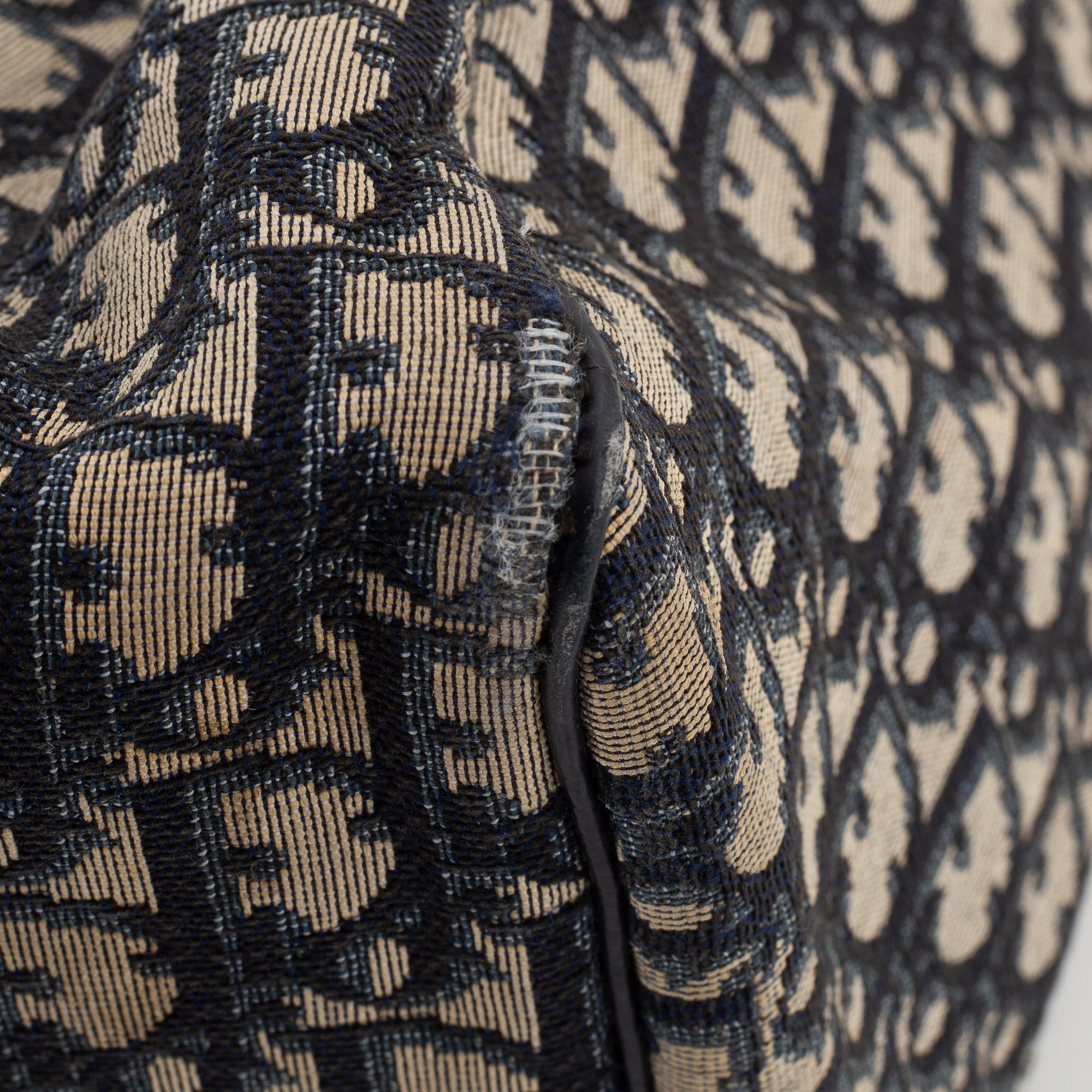 Christian Dior, a canvas handbag, toilet bag and key holder.