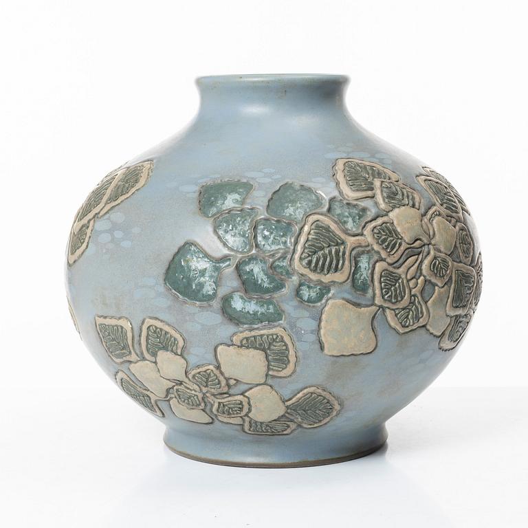A blue glazed relief vase, possibly Korea, around 1900.