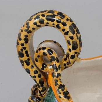 An Italian porcelaine 20th century  table centerpiece with lion feet and snake handles.