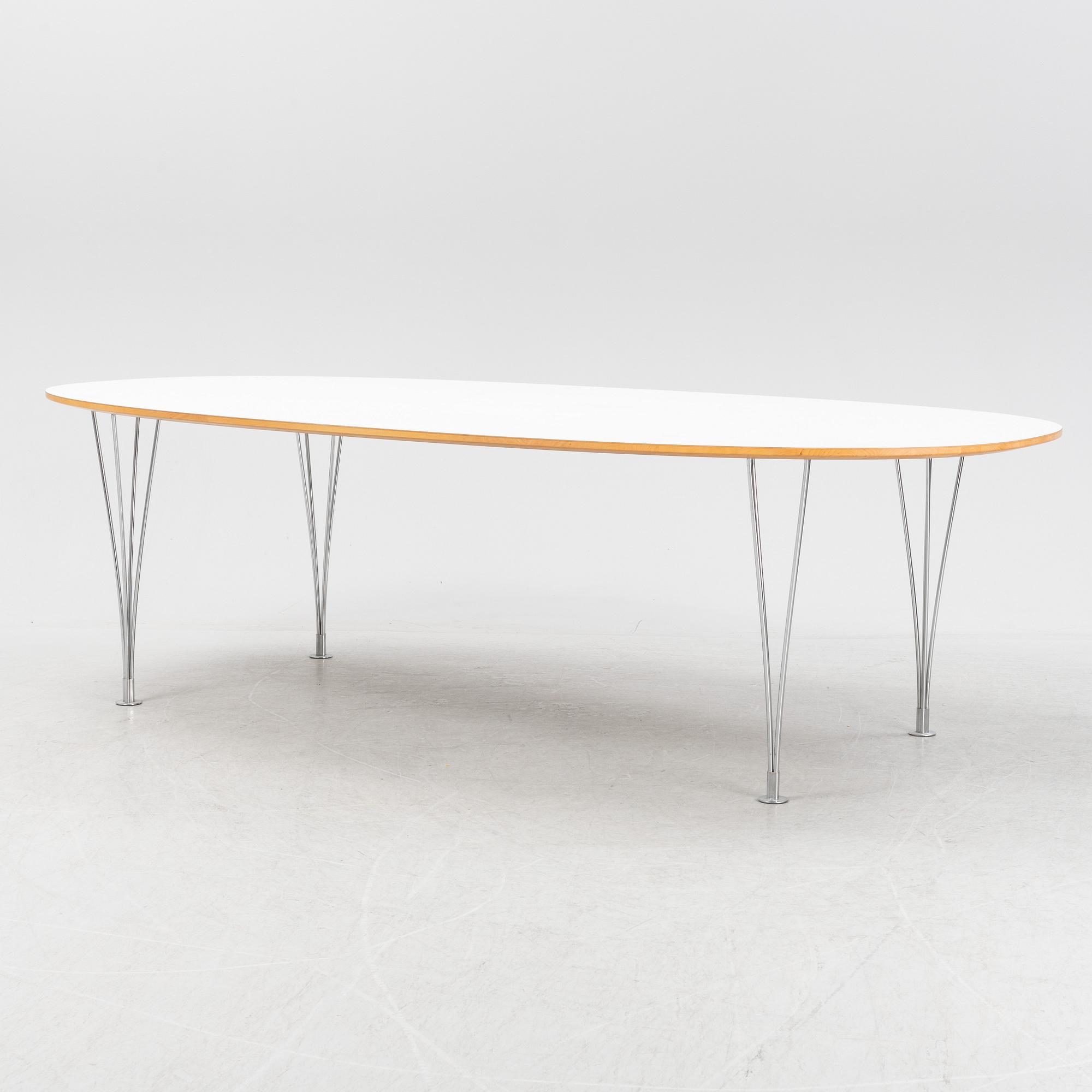 A Super ellpitical dining table, by Bruno Mathsson and Piet Hein for Fritz Hansen dated 2008.